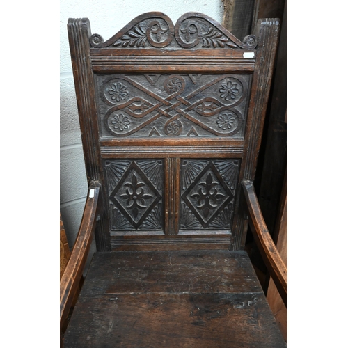 554 - A carved oak Wainscot style armchair in the 17th century manner