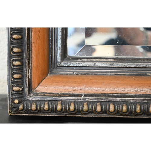 556 - A full length bevelled rectangular mirror in egg and dart carved and moulded hardwood frame