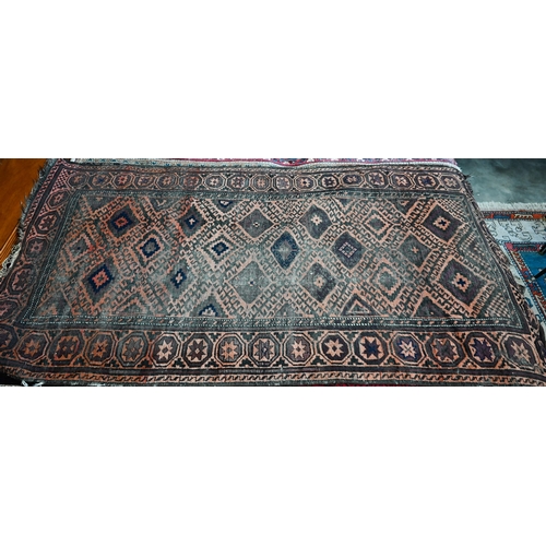 566 - An old worn Persian Baluch, arrangement of diamond medallions on brown ground, rosette border, 214 x... 