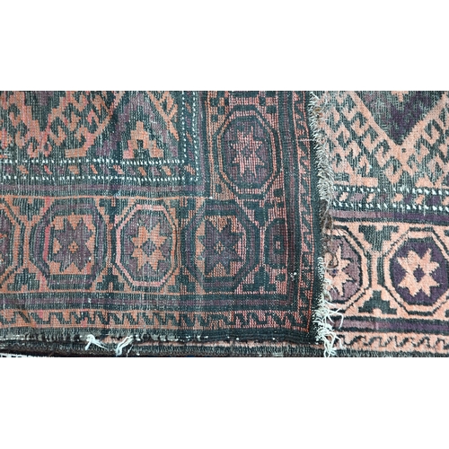 566 - An old worn Persian Baluch, arrangement of diamond medallions on brown ground, rosette border, 214 x... 