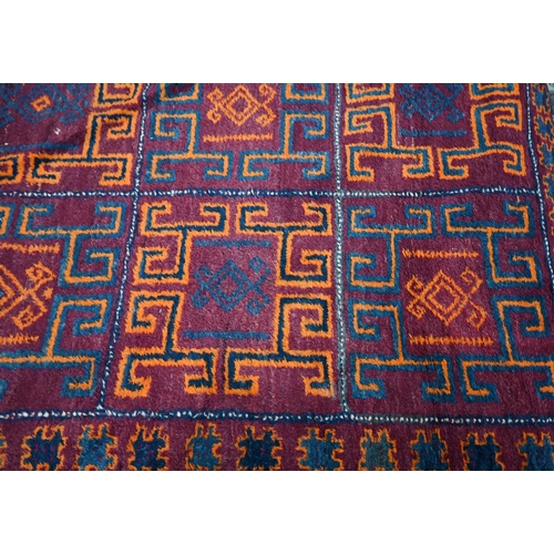 567 - A Kurdish kelim and rug, orange and blue tile design on wine ground with conforming borders, 222 x 1... 