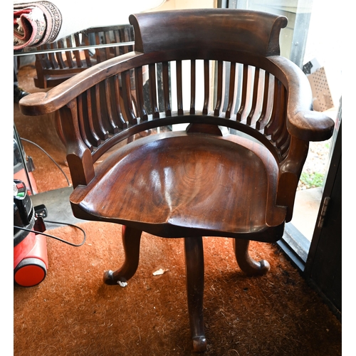 577 - Early 20th century mahogany swivelling captain's chair on four shaped legs