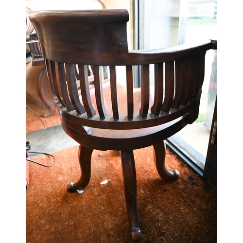 577 - Early 20th century mahogany swivelling captain's chair on four shaped legs