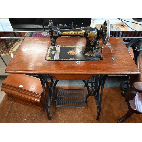 578 - An early 20th century 'Jones' mahogany sewing table on wrought and cast iron tredle base, the integr... 