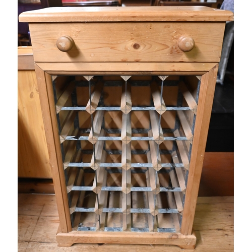 587 - A pine wine-rack with drawer, 49 x25 x 79 cm h