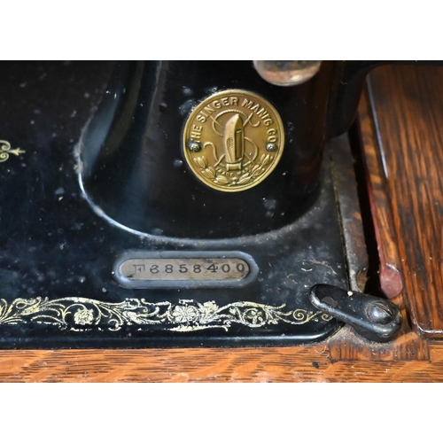 588 - A vintage cased Singer hand sewing machine