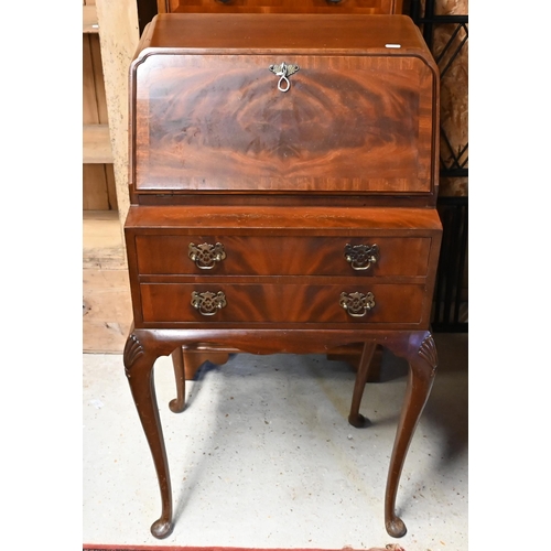 590 - A ladies walnut bureau raised on hip carved cabriole legs, circa 1950s, 54 x 40 x 98 cm h (back leg ... 