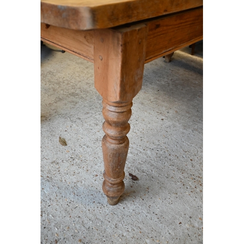 598 - A pine kitchen table raised on turned legs, 183 x 84 x 79 cm h