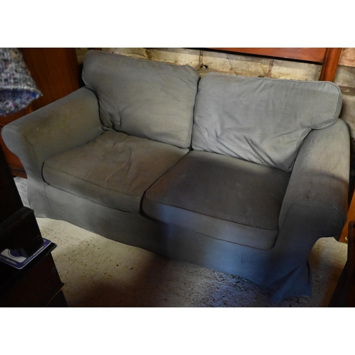 605 - #A modern dark grey loose covered two seat sofa