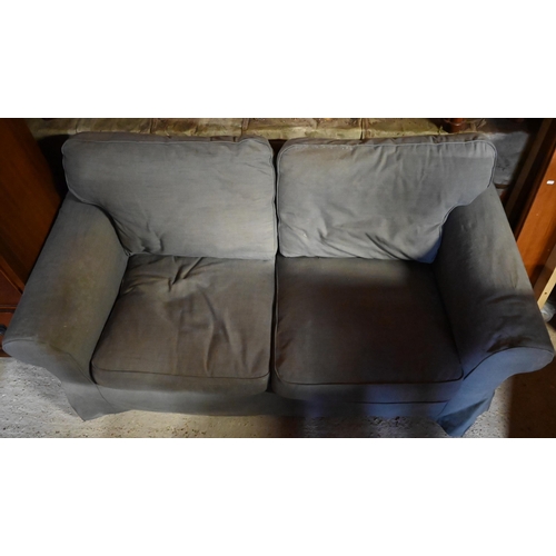 605 - #A modern dark grey loose covered two seat sofa