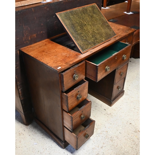 615 - A Victorian reading/writing table with central leather inset easel panel over an arrangement of nine... 