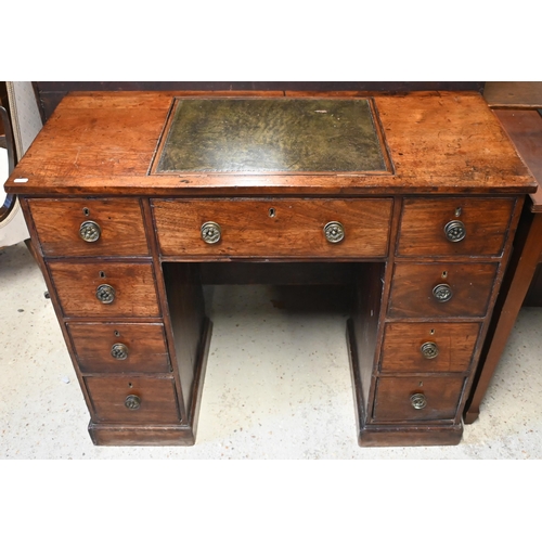 615 - A Victorian reading/writing table with central leather inset easel panel over an arrangement of nine... 