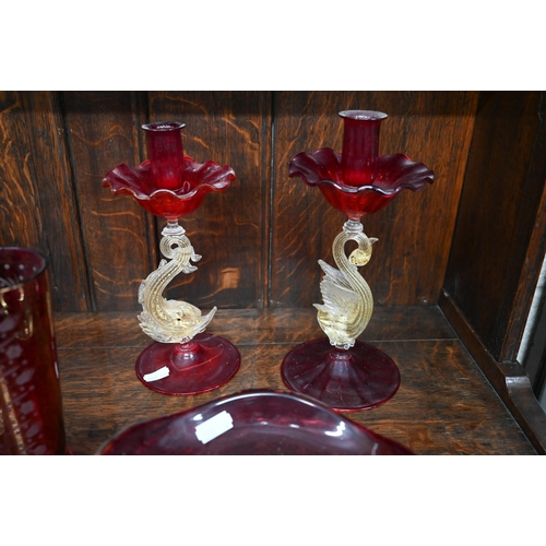 74 - Pair of Venetian ruby and gilt glass candlesticks, with dolphin and swan stems, 24 cm high to/w a wh... 