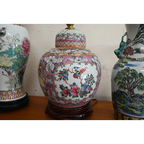 79 - Two modern Chinese famille rose ceramic lamps, to/w a similar vase (3)