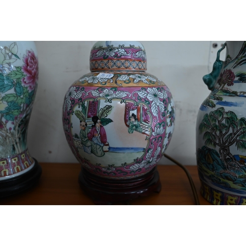 79 - Two modern Chinese famille rose ceramic lamps, to/w a similar vase (3)