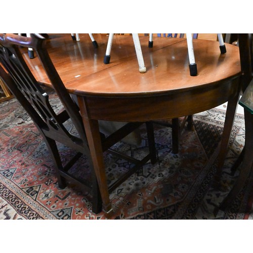 289 - A Georgian mahogany d-end dining table, with 2 leaves, raised on moulded square legs