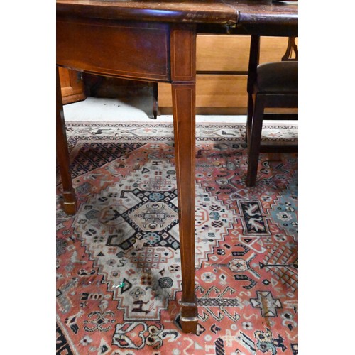 289 - A Georgian mahogany d-end dining table, with 2 leaves, raised on moulded square legs