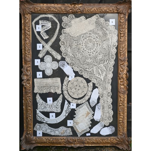 199 - A framed collection of antique lace fringings, trimmings, collars, lace-edged handkerchief, and a ne... 