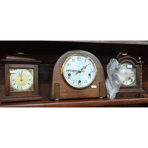 393 - A walnut and brass mounted mantel clock with moon-phase dial and twin train movement, 24 cm high c/w... 