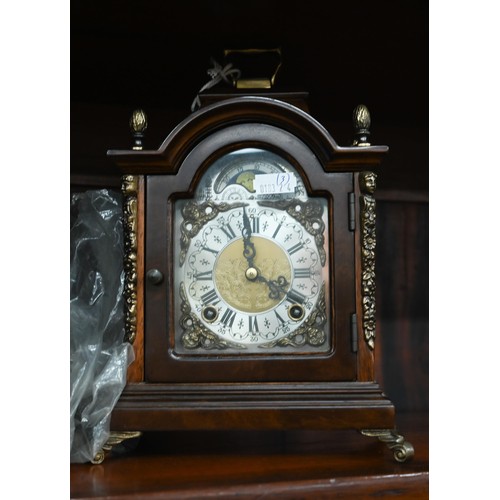 393 - A walnut and brass mounted mantel clock with moon-phase dial and twin train movement, 24 cm high c/w... 