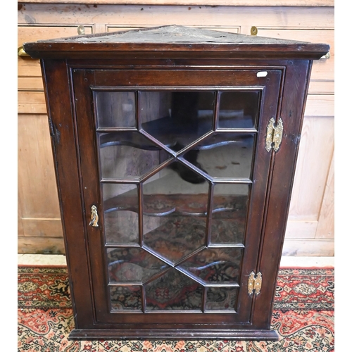 12 - A George II mahogany astragal glazed hung corner cabinet