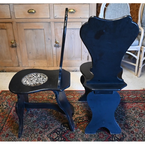 15 - A pair of George II style ebonised and faux marble panelled hall chairs (2)