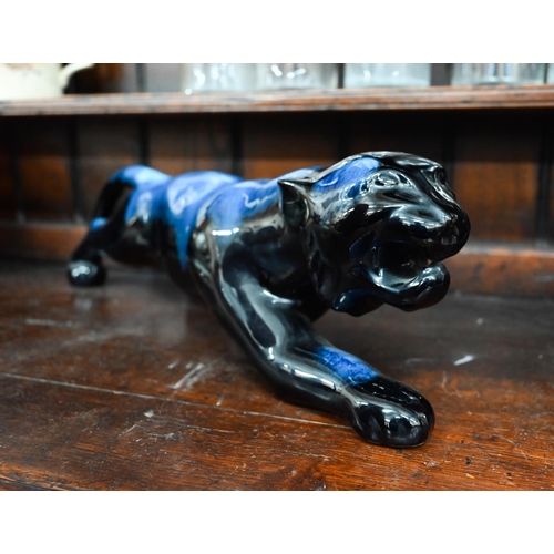 75 - Blue-glazed earthenware panther, 53 cm long