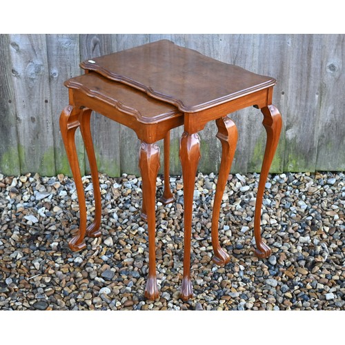 554 - A nest of two walnut occasional tables