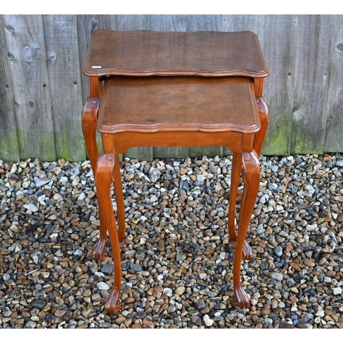 554 - A nest of two walnut occasional tables