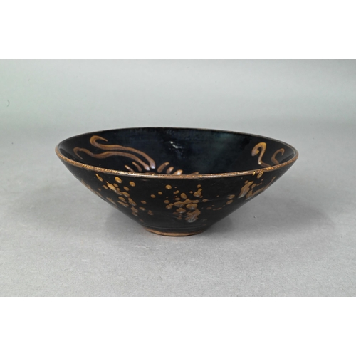 504 - A Chinese Southern Song style Jizhou stoneware bowl, the interior with three paper-cut phoenix desig... 