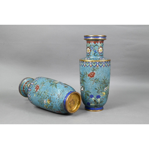 511 - A pair of 19th century Chinese cloisonne on brass rouleau vases decorated in polychrome enamels with... 