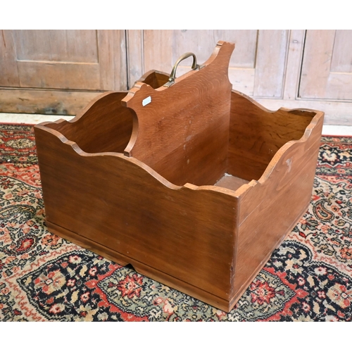 22 - An oak two division wine carrier, with hinged brass handle