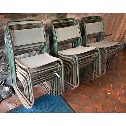 431 - Twenty mid-century stacking utility chairs, weathered green steel frames with canvas seats/backs - f... 