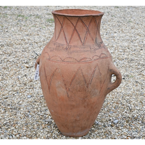 252 - A large terracotta two handled classical urn, 72 cm high