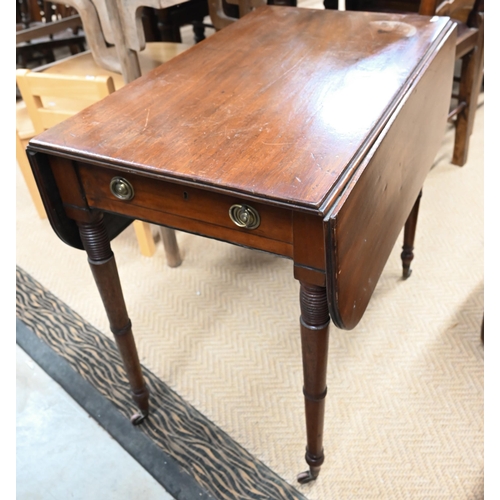 517 - # A 19th century mahogany Pembroke table with turned supports and small casters