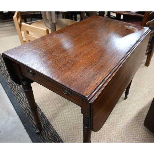 517 - # A 19th century mahogany Pembroke table with turned supports and small casters