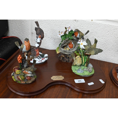 101 - Danbury Mint set of four resin groups by Ann Richmond 'A Robin for All Seasons', on oak plinth to/w ... 