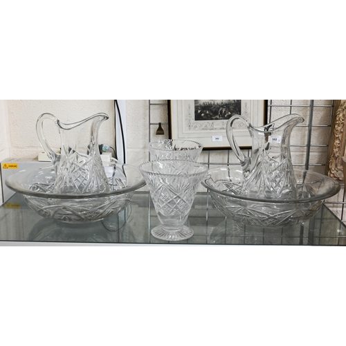 102 - Pair of large cut glass jugs and bowls to/w two cut glass flared vases (one stapled)