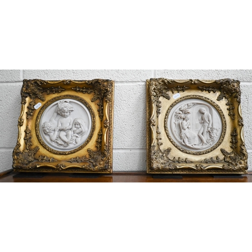 121 - Two gilt-framed reconstituted marble circular relief plaques depicting courting couple and playful p... 