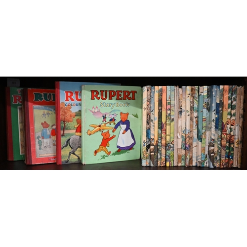 125 - Twenty-nine Rupert Bear annuals and other related volumes, 1940s-1970s