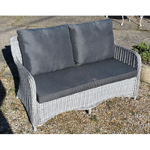 13 - An all-weather grey wicker style two seat garden sofa, c/w cover and cushions