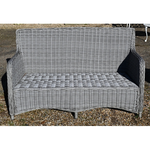 13 - An all-weather grey wicker style two seat garden sofa, c/w cover and cushions