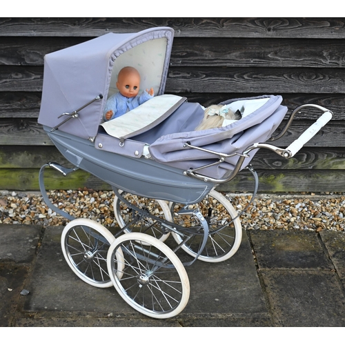 158 - Silver Cross baby's pram in grey livery c/w two dolls