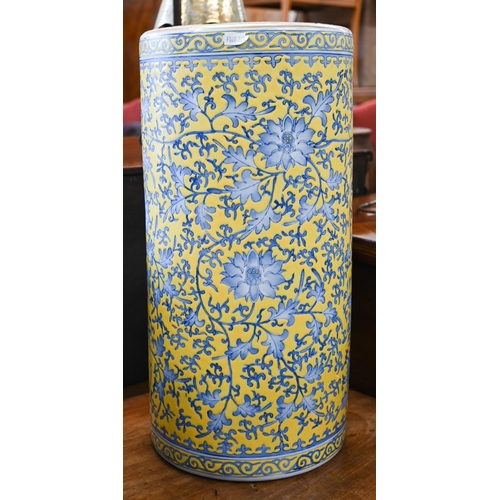 Japanese porcelain cylindrical stick-stand with blue floral and foliate decoration on a yellow ground, 40 cm