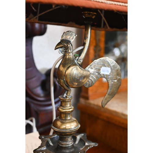 194 - # An antique Indian brass oil-lamp, surmounted by a cockerel, 36 cm, with later light-fitting... 