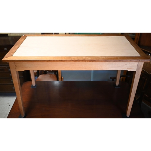 26 - A modern oak  dining table with rectangular aperture to the top - previously fitted with a glass pan... 