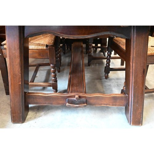 433 - A Continental Basque-style oak dining suit comprising extending dining table, 270 x 100 x 75 cm high... 