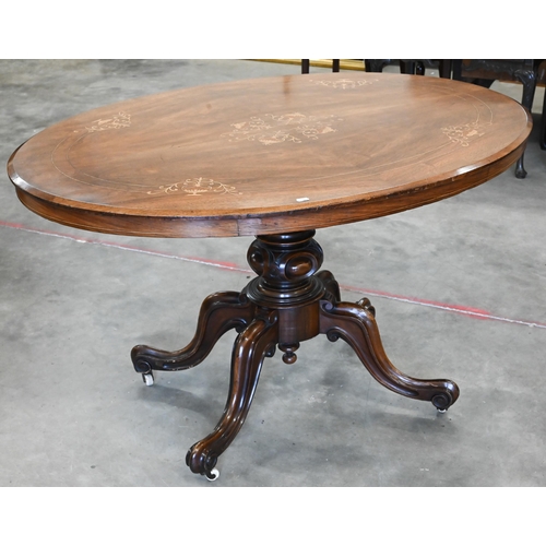 440 - A Victorian inlaid walnut loo table with oval tilt-top on turned column and four scrolling legs with... 