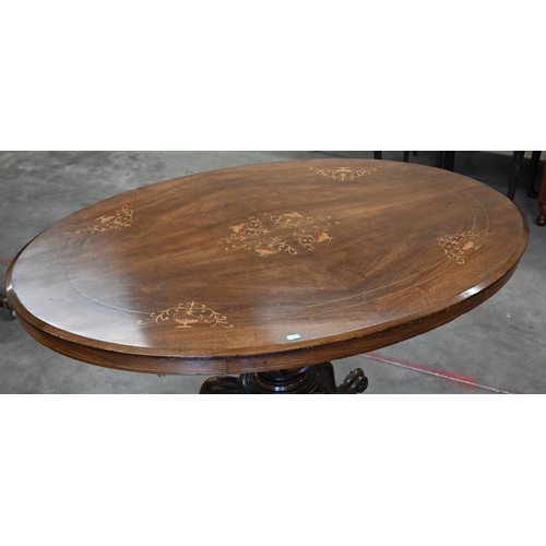 440 - A Victorian inlaid walnut loo table with oval tilt-top on turned column and four scrolling legs with... 