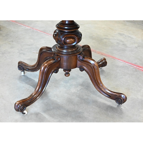 440 - A Victorian inlaid walnut loo table with oval tilt-top on turned column and four scrolling legs with... 